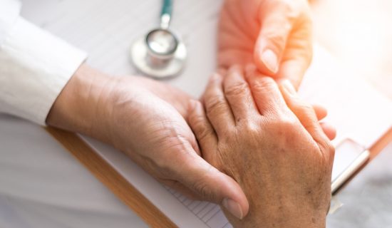 Geriatric doctor or geriatrician concept. Doctor physician hand on happy elderly senior patient to comfort in hospital examination room or hospice nursing home or wellbeing county. Geriatric doctor or geriatrician concept. Doctor physician hand on happy elderly senior patient to comfort in hospital examination room or hospice nursing home or wellbeing county.